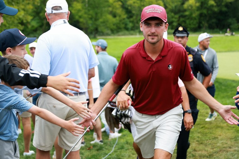 ARDMORE, PENNSYLVANIA - AUGUST 16: Jack Whaley of England greets fans en route to the 14th hole on day seven of the U.S. Amateur Championship at Merion Golf Club on August 16, 2026 in Ardmore, Pennsylvania. (Photo by Isaiah Vazquez/Getty Images)