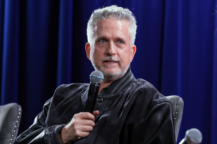 Bill Simmons speaks on a microphone.