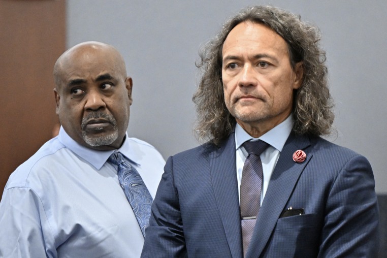 Michael Sanft and Duane Davis standing inside a courtroom side-by-side.