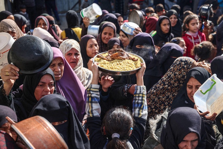 People gather to receive food.