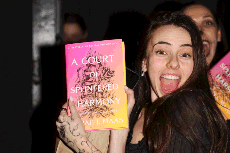 GIF: Image carousel of ACOTAR fans dressed in costume at a book release party.