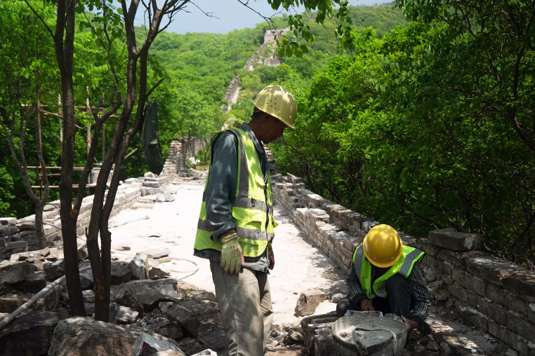 Construction workers at Phase 5 of the Great Wall reconstruction in Jiankou, China on Tuesday.