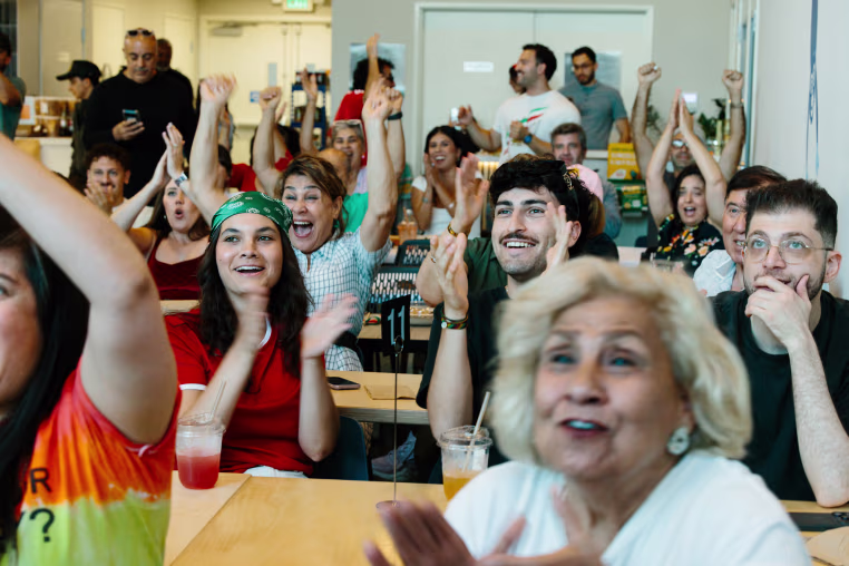 Spectators react at the Iran vs. New Zealand World Cup game watch party at Meymuni Cafe in Los Angeles on June 15, 2026.