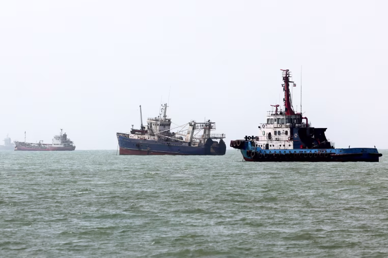 Three ships in a row on the water