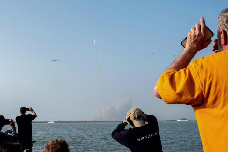 Spectators watch from South Padre Island, Texas, as the SpaceX Starship launches.
