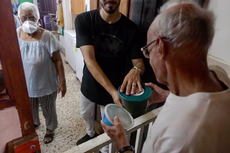 People give food to church goers.