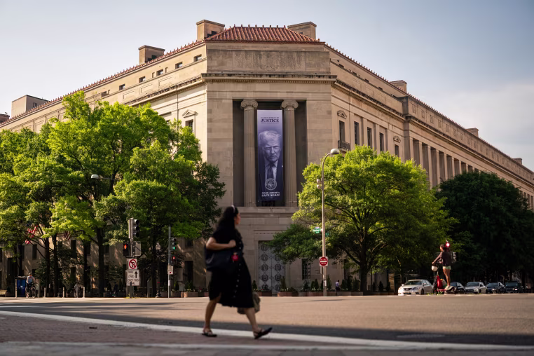 A banner of U.S. President Donald Trump outside of the Department of Justice. 