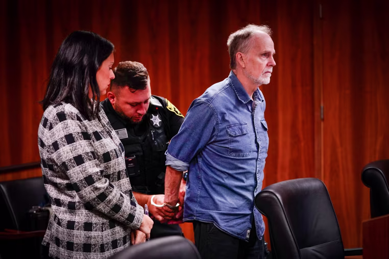 Defense attorney Alona Sharon stands at left as her client, Jeffrey Mosteller, is handcuffed. Mosteller is sentenced to 19