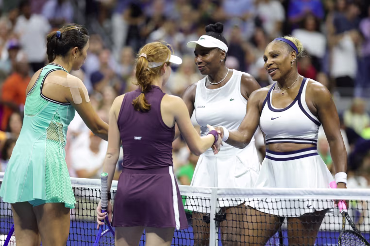 Image: Venus and Serena Williams shake hands with Maya Joint and Chan Hao-ching after losing their women's doubles match at the U.S. Open.