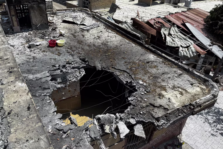 A destroyed rooftop is seen in an aerial view