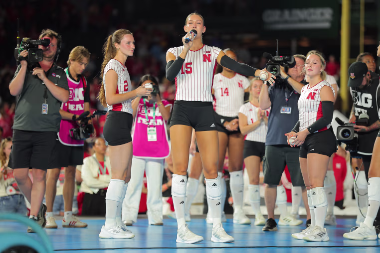 Nebraska's Andi Jackson speaks from a volleyball court.