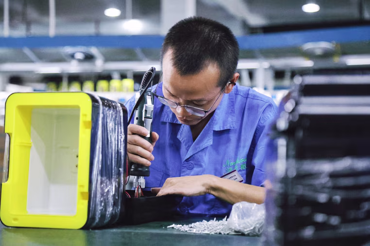 Workers Produce Mini Fridges For Export In Shaoxing