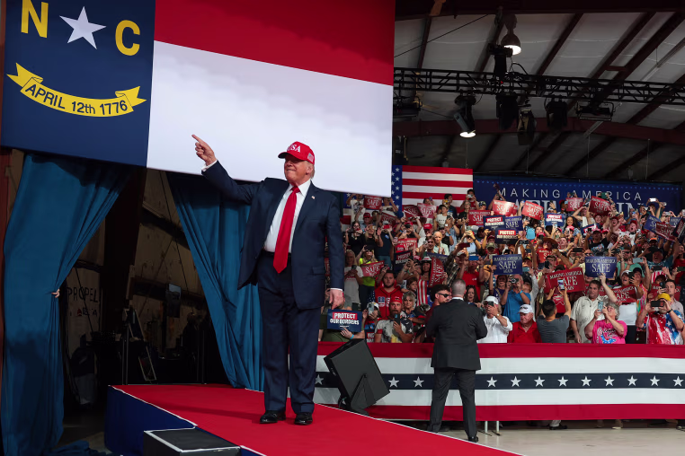 U.S. President Donald Trump greets supporters.