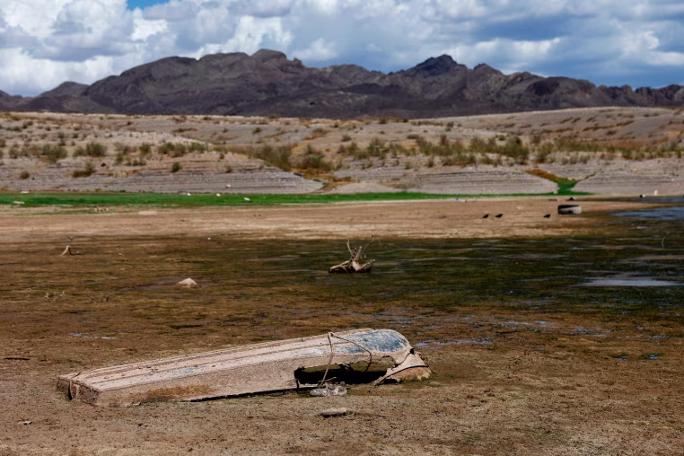 An abandoned boat sits in an area of Lake Mead that was previously underwater.