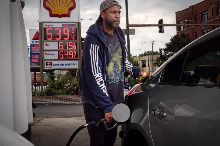 Driver fills his car with gas