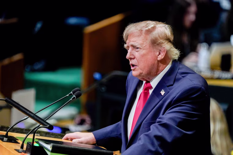 Donald Trump speaks at a podium