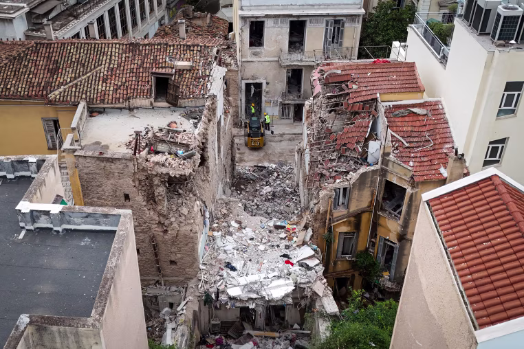 Excavators remove debris.