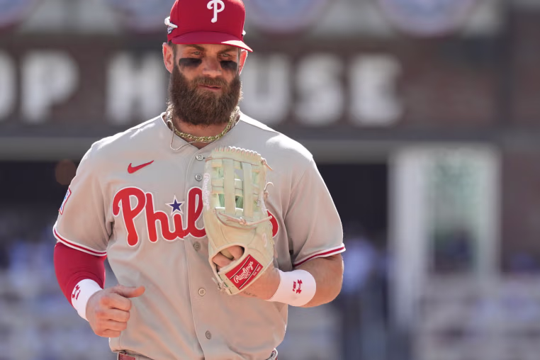 Sep 29, 2026; Cumberland, Georgia, USA; Philadelphia Phillies first baseman Bryce Harper (3) walks to the dug out in the fourth inning during game one of the Wildcard round for the 2026 MLB Playoffs at Truist Park. Mandatory Credit: Dale Zanine-Imagn Images