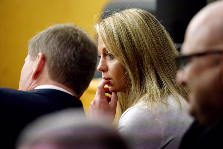 Image: Fired Dallas police officer Amber Guyger listens to her attorney at court on Sept. 24, 2019.