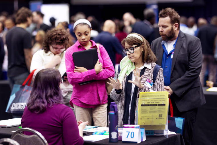 Job seekers attend a small business summit and job fair on May 12, 2026 in Chicago.