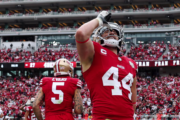 Kyle Juszczyk of the San Francisco 49ers performs his signature "drinking" gesture after scoring a touchdown against the Miami Dolphins on Sept. 20, 2026.