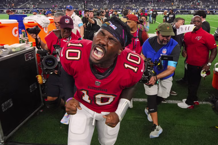 Tampa Bay Buccaneers quarterback Jalon Daniels yells in celebration.