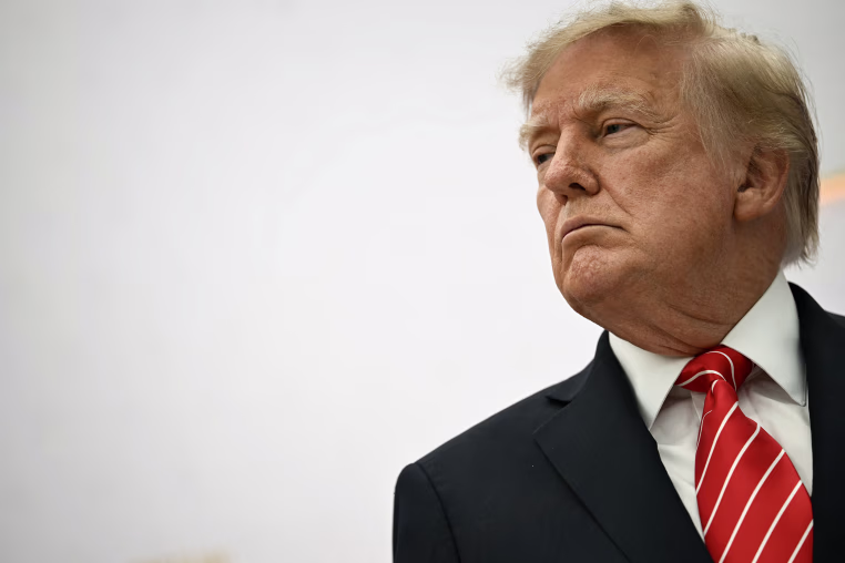 Donald Trump against a white backdrop.