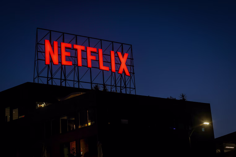 Netflix sign on the roof of an office building.