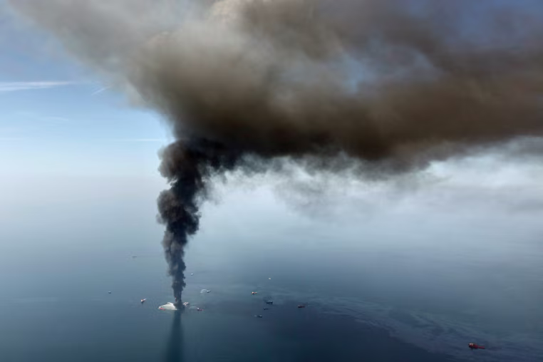 In this April 21, 2010, file photo, the Deepwater Horizon oil rig burns in the Gulf of Mexico. As oil spewed into the Gulf of Mexico from a blown-out BP well in 2010, residents wondered whether their home would ever be the same. The Deepwater Horizon disaster changed the region, with a flood of spending altering landscapes and attitudes.