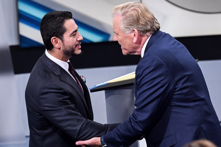 U.S. Senate candidates Democrat Abdul El-Sayed, left, and Republican Mike Rogers shake hands.