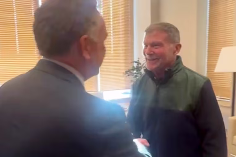 Image: Steve Witkoff and Stephen Hubbard shake hands.