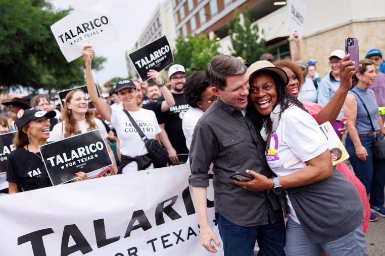 Texas State Rep. James Talarico is hugged by a supporter during a Juneteenth march in Fort Worth, on June 19, 2026. 