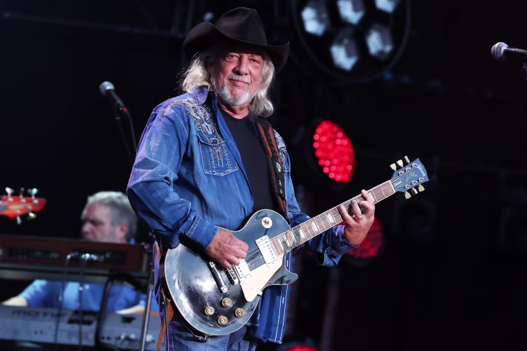 Image: Terry Wyatt playing electric guitar.