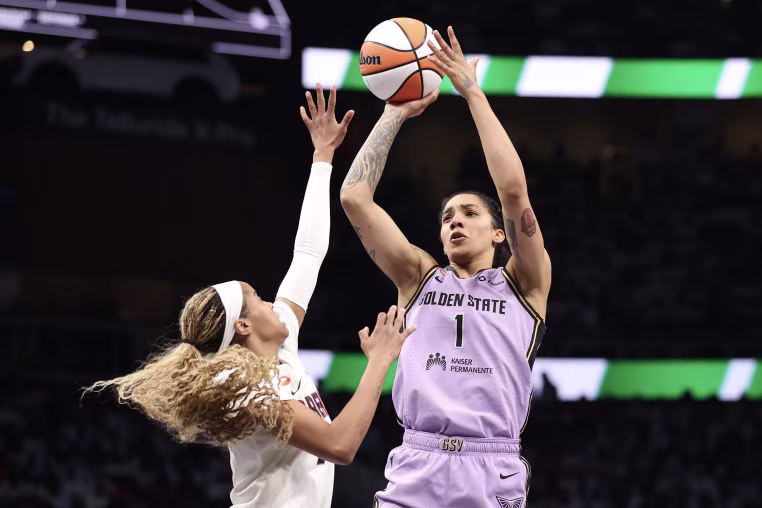 On-court action during a WNBA basketball game.