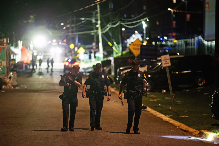 Image: The Tallahassee Police Department investigates the scene of a shooting that occurred on Perry Street, behind Bragg Memorial