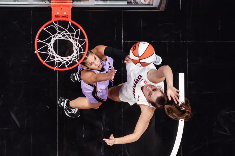 Isobel Borlase of the Atlanta Dream, right, shoots the ball against Veronica Burton of the Golden State Valkyries
