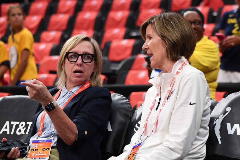 BOSTON, MA - JULY 15: Indiana Fever Chief Operating Officer and General Manager Amber Cox (left) and Indiana Fever President of Basketball and Business Operations Kelly Krauskopf (right) interact before a WNBA game between the Indiana Fever and the Connecticut Sun on July 15, 2025, at TD Garden in Boston, MA. (Photo by Erica Denhoff/Icon Sportswire via Getty Images)