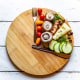 Vegetables on round chopping board, symbol for intermittent fasting