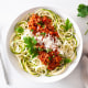 keto paleo zoodles bolognese: zucchini noodles with meat sauce and parmesan