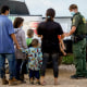 Image: Migrants are processed by the United States Border Patrol after crossing the U.S.-Mexico border into the United States in Penitas, Texas on July 8, 2021.