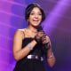 Image: Maitreyi Ramakrishnan accepts the award for \"Comedy Show of 2020\" during the E! People's Choice Awards in Santa Monica, Calif., in November 2020.