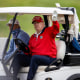 Then-President Donald Trump golfs at Trump National Golf Club on Nov. 27, 2020, in Sterling, Va.