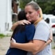 Miltreda Kress hugs her daughter, Brianna Donahue, in front of their home in Philadelphia.