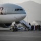 Image: Passengers board a Qatar Airways charter flight carrying foreigners and Afghans to Qatar, at the airport in Kabul, Afghanistan on Sept. 10, 2021.