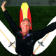 Image: \"Y\", formerly known at Tom Morey, flashes his signature pose with his new surfboard design. He is ma