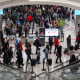 Image: Travelers form lines outside the TSA security checkpoint during the holiday season as the new Omicron Covid variant threatens to increase case numbers at Hartsfield-Jackson Atlanta International Airport on Dec. 22, 2021.
