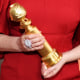 Image: An actor holds her statue at the Golden Globe Awards in Beverly Hills, Calif., on Jan. 5, 2020.