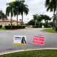 Campaign signs in Miramar, FL on January 11 outside a polling place for a special election for Florida's 20th Congressional District seat. Democrat Sheila Cherfilus-McCormick, a health care company CEO, faces Republican Jason Mariner in the special election to fill the U.S. congressional seat left vacant after Democratic U.S. Rep. Alcee Hastings died last April of pancreatic cancer.