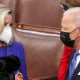 Image: House Republican Conference Chairperson Rep. Liz Cheney, R-Wyo., speaks with President Joe Biden as he arrives to address a joint session of Congress in the House Chamber at the U.S. Capitol, on April 28, 2021.
