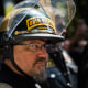Image: A man wearing a helmet that reads,\"Oath Keepers\".